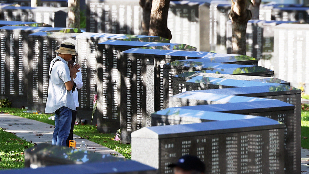 People offer prayers for the victims of the Battle of Okinawa at the Cornerstone of Peace in Itoman, Okinawa, Japan, June 23, 2026. /VCG
